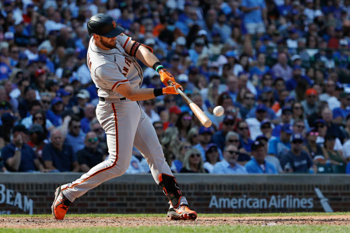 SF Giants third baseman Evan Longoria connects with a pitch against the Cubs. (2021)